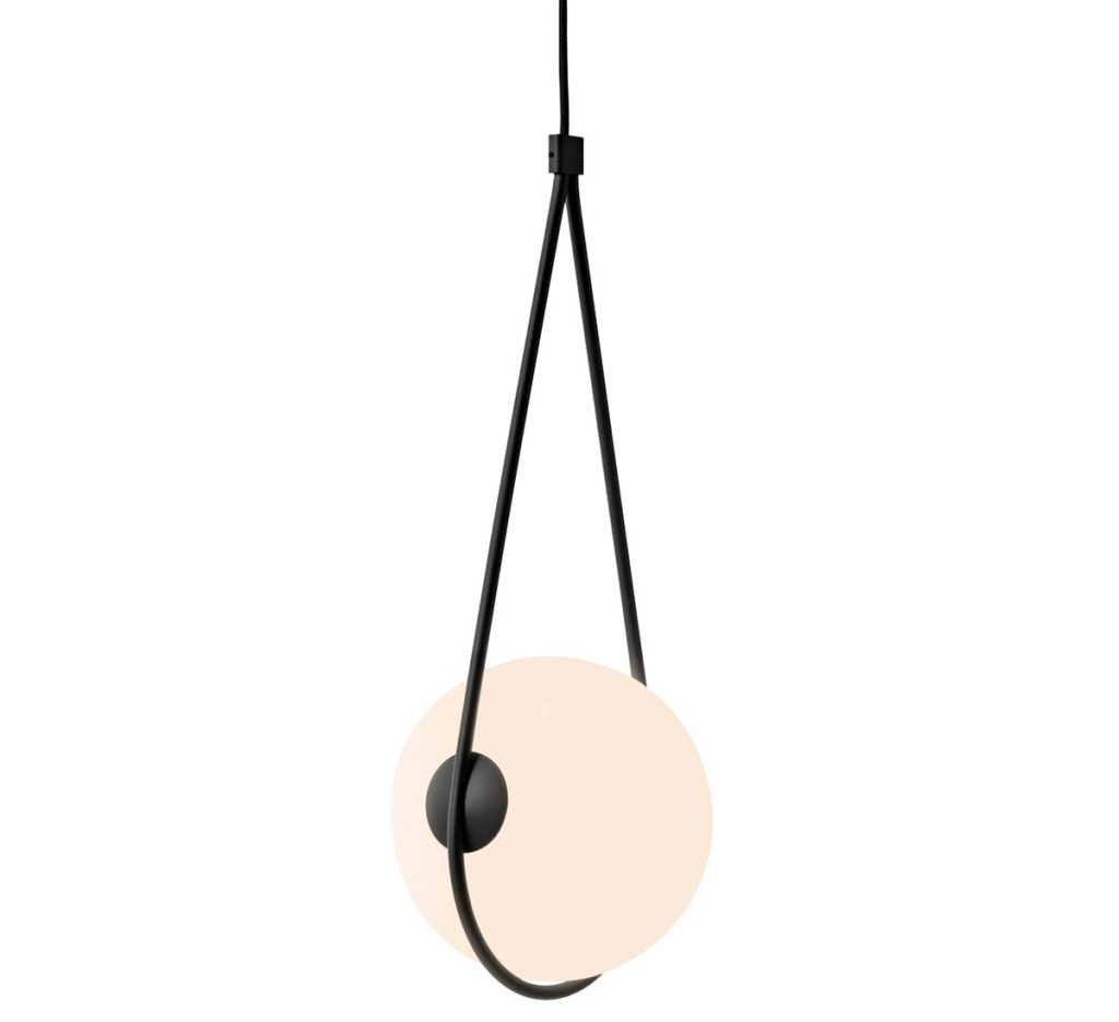 The electric cable of the Corda pendant by Guilherme Wentz for Sossego becomes one with its metal sling, providing the perfect cupping for the glass lamp. 