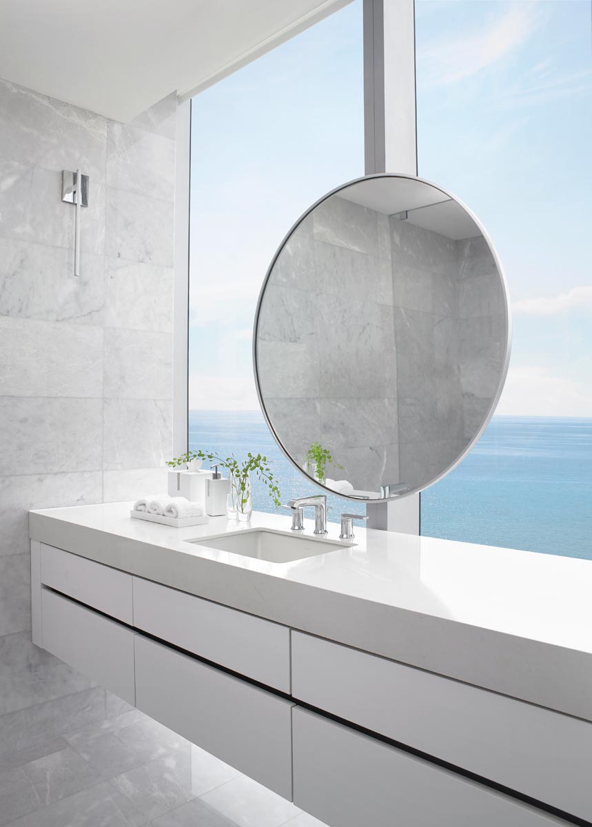 “A floating, six-drawer, wall-to-wall vanity with a view” is how Geller describes this area of the primary bath.