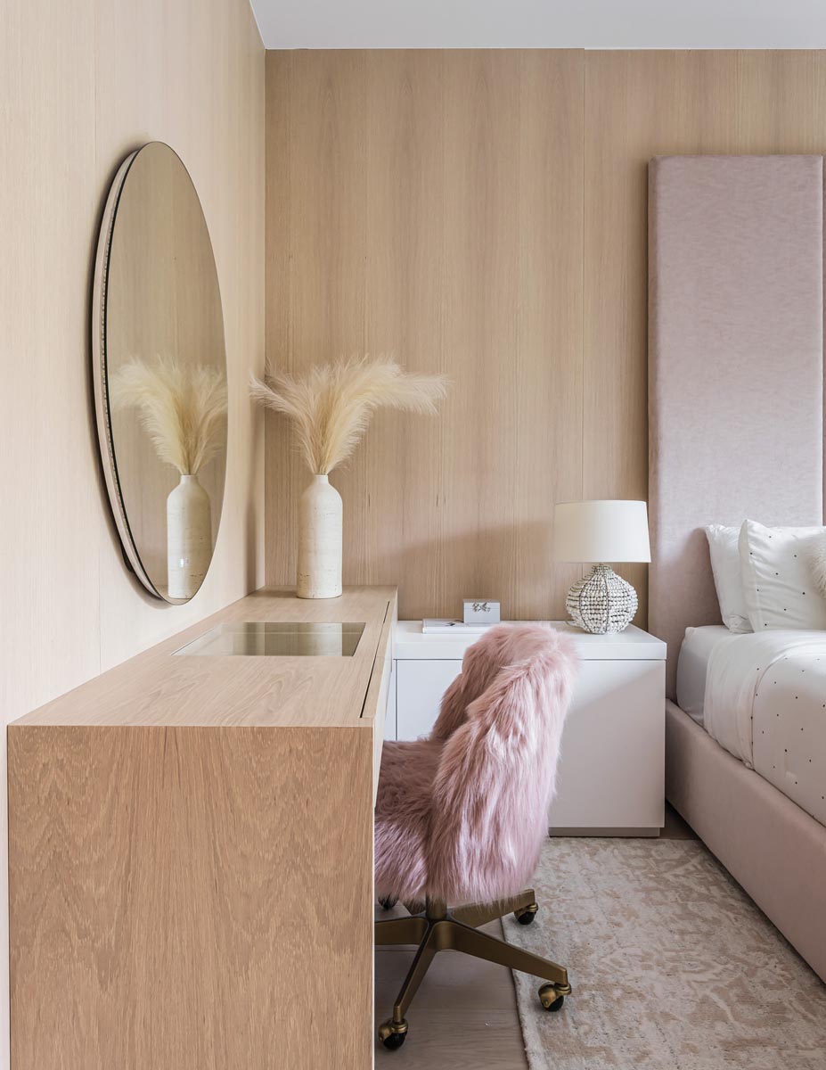 In the daughter’s bedroom, a desk doubles as a vanity. A shaggy chair from RH solidifies the room’s intended feminine feel.