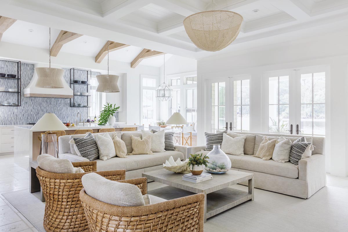 Leonard pulled from the gray and white tiles on the kitchen backsplash to create the color palette for the rest of the open kitchen and dining space. The whitewashed beams over the island provide the room’s wow factor.