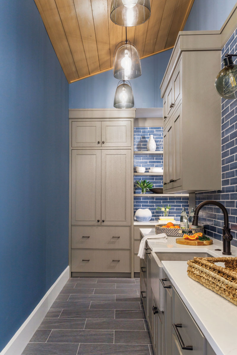 This dual-purpose butler’s pantry/wine grotto serves as a back kitchen staging area with extra refrigerators, Sub-Zero wine coolers, and supplemental counter space.