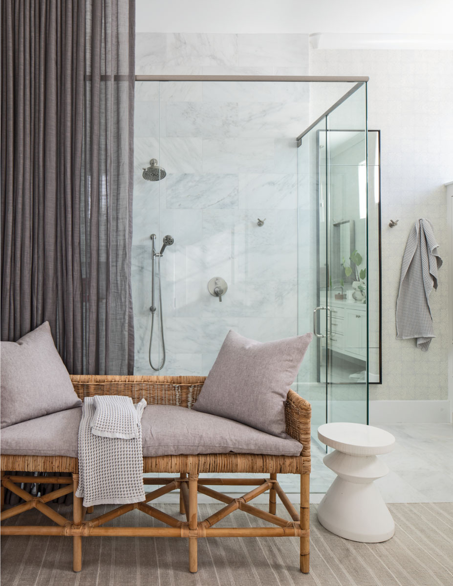 “Part of the goal in the master bath was to create a spa-like space,” says Booth. “By using drapery and furnishings, we created an intimacy and comfort to this space. The daughter can come in as her mother is getting ready for an event and talk to her in this sweet little space.”