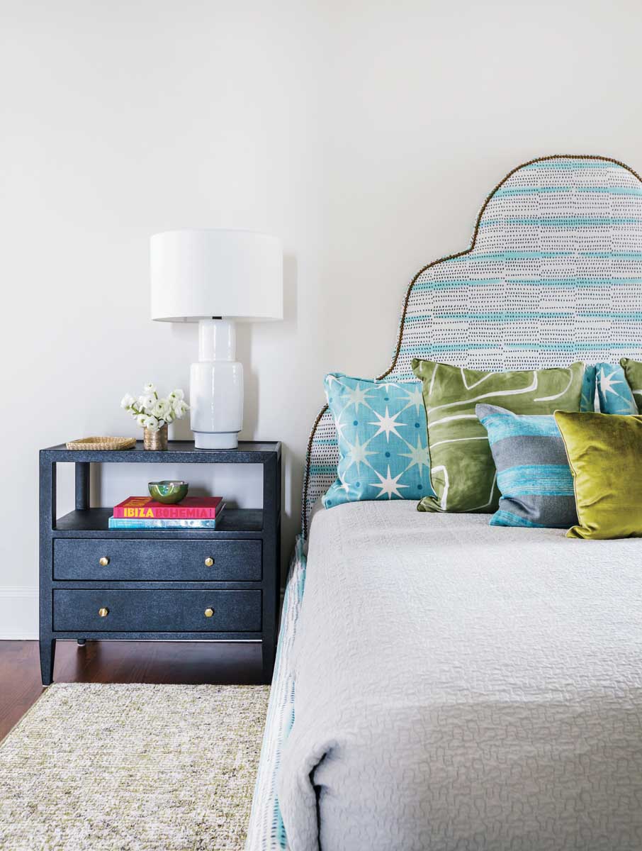 As in the other rooms in the home, the varying shades of blue in this guestroom reflect the views beyond the windows.