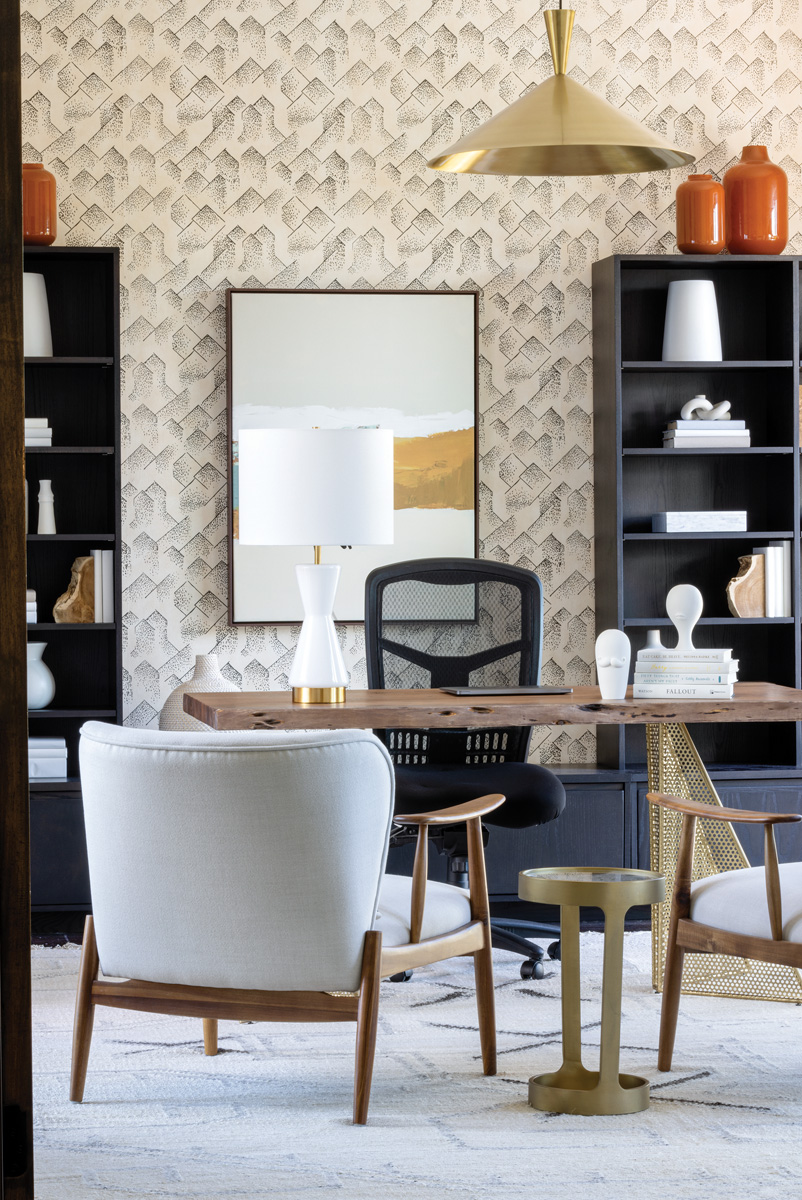 For the husband’s office, Alonso opted for Kelly Wearstler wallpaper and found a unique Sunpan Modern desk from Perigold. The occasional chairs, lighting, and area rug came from CB2.