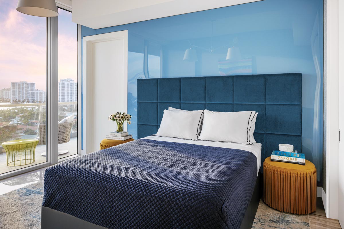 A glossy blue wall in one of the guest rooms reflects natural light from the Intracoastal.