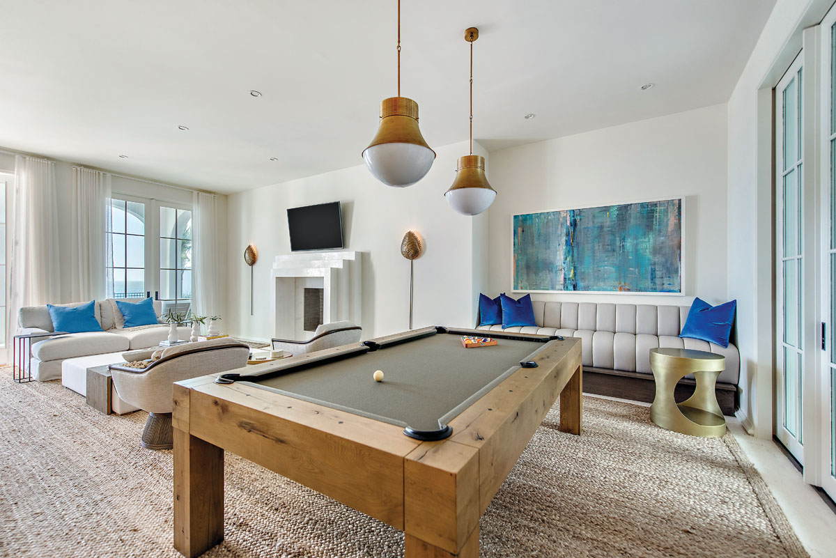 A pool table in the family room nods to the homeowners’ penchant for entertaining. “We regularly had large parties before COVID-19 and guests were always blown away,” says Pamela. “They came expecting a traditional beach house. But this is not just a beach house, but a spectacular home.”