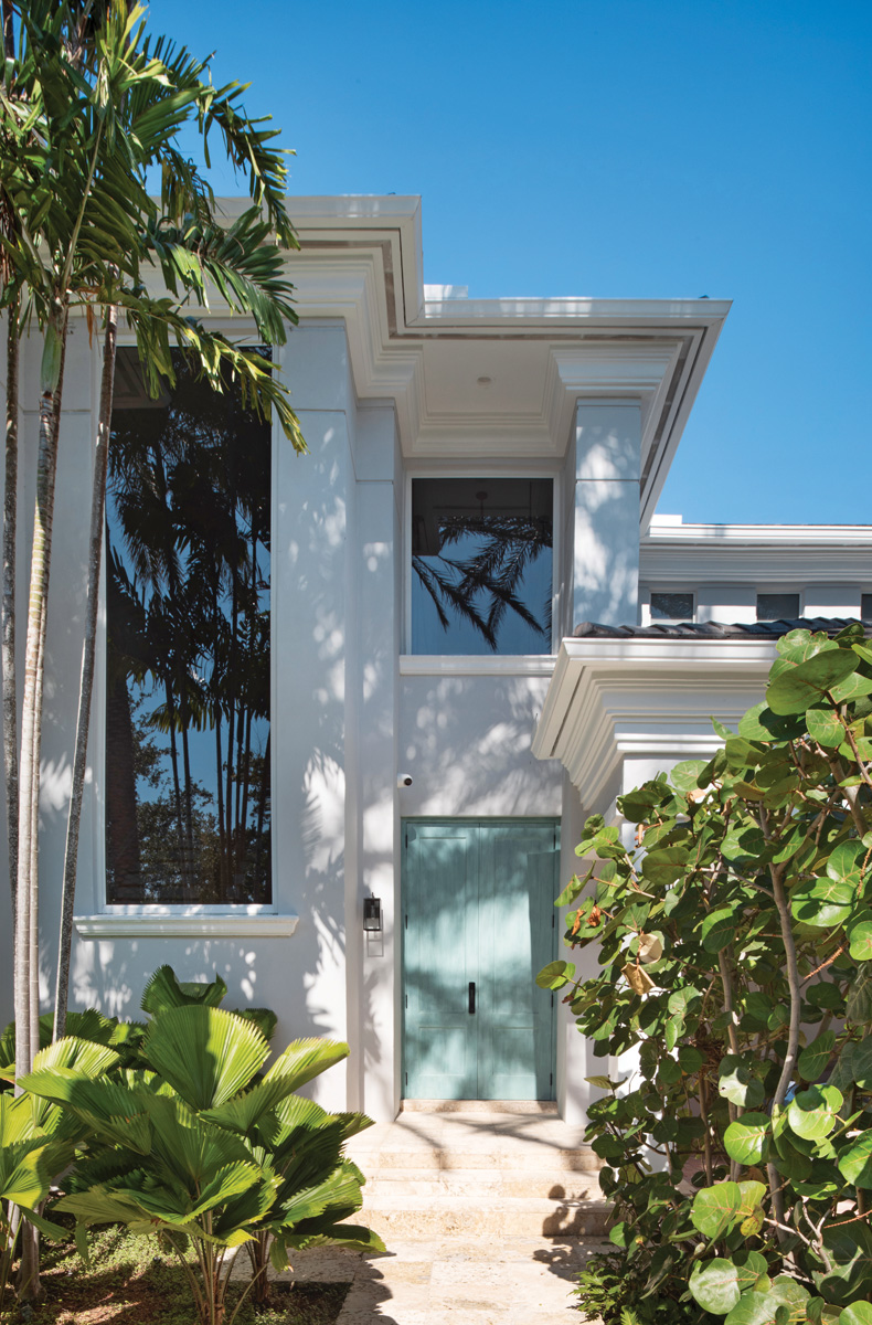 Great effort went into achieving the ideal green shade for the home’s front door. Architect Carol Farah saw the color in a Bulgari ad and hired an artist to re-create it.