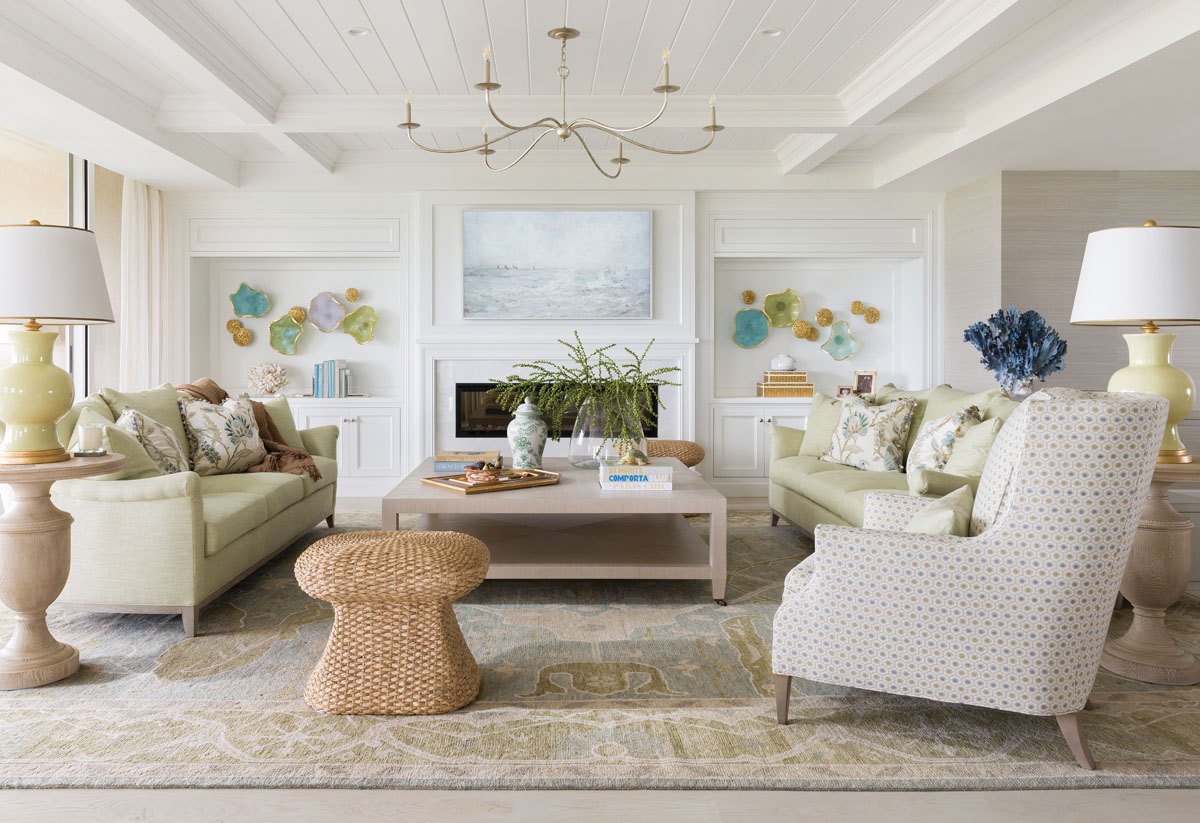 Bathed in natural light, the formal living room features a serene palette of colors and a variety of textural elements that add dimension to the space. Designer Carrie Brigham installed custom millwork, which she says “elevates the level of intricacy of the overall design, fully integrating and connecting the home from space to space.”