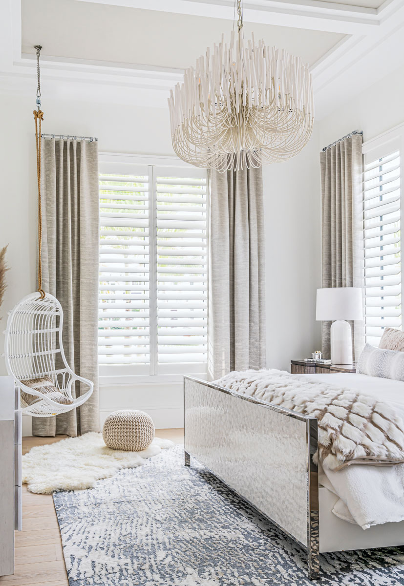 Midnet’s design team felt this bedroom’s John-Richard chandelier mimicked a giant sea creature, so they made this room the most coastal looking of the bunch with a white bamboo swing and natural details such as a lacquered mother-of-pearl headboard.