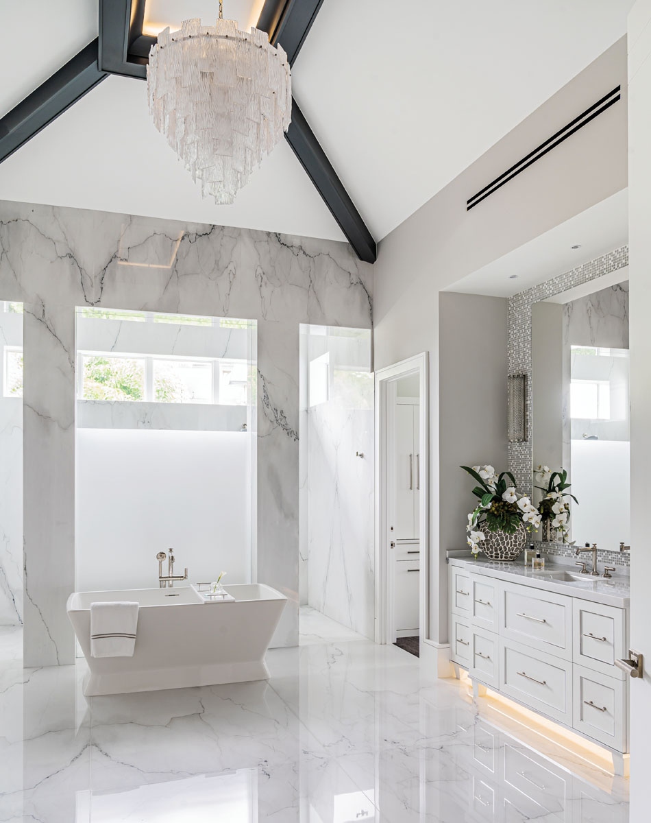 Marble is a main component of the master bath, a spa-like retreat that makes the most of natural light.