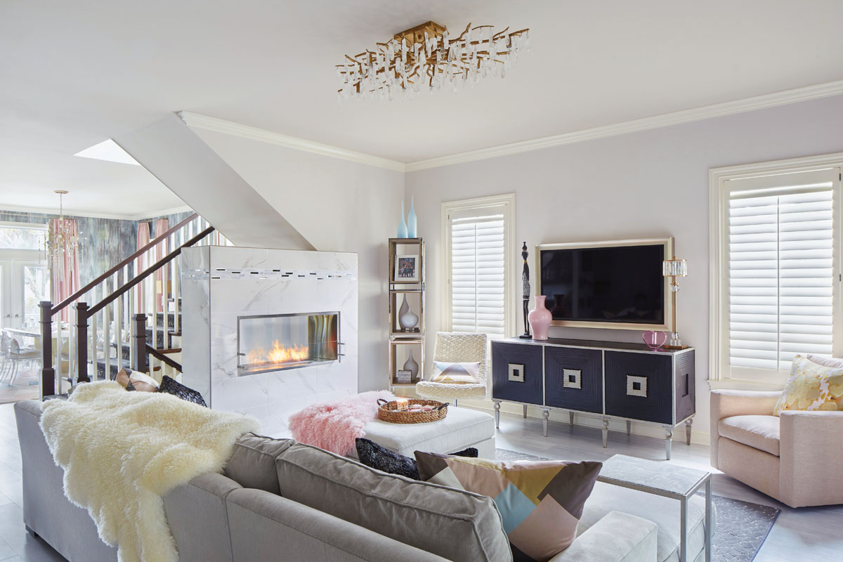 Robyn Branch_FD31-2B Photography by Zeke Ruelas Photography, Nashville, TN The homeowner wanted to up the cozy factor in her living room by installing a fireplace. There was no wall space for such an addition, so Branch decided to add a hearth to the stairway space instead. Pet-friendly sheepskin and fur throws adorn the furniture.